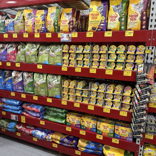 Cat food on the shelves inside of the Pet Goods store