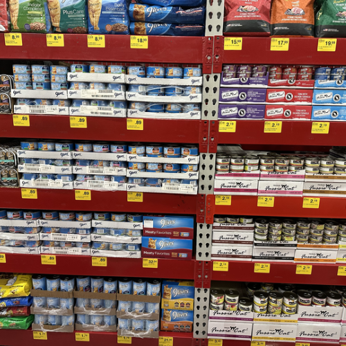 Cat food on the shelves inside of the Pet Goods store