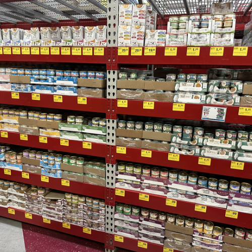 Cat food on the shelves inside of the Pet Goods store